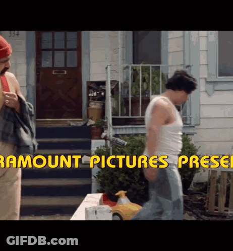 Two Men Are Standing In Front Of A House With The Words Paramount Pictures Pressed GIF