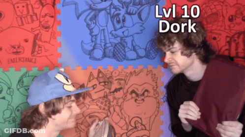 Two Men Are Standing In Front Of A Puzzle Mat That Says Lvi 10 Dork On It GIF