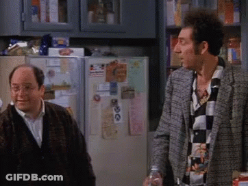 Two Men Are Standing In Front Of A Refrigerator With A Sticker On It That Says ' I Love You ' GIF