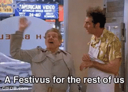 Two Men Are Standing In Front Of A Sign That Says American Video . GIF