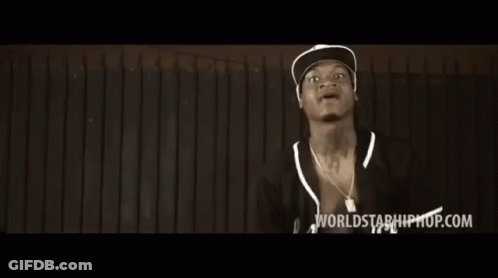 Two Men Are Standing In Front Of A Wooden Wall And The Words Worlds Of Hiphop.com Are On The Bottom Of The Screen GIF