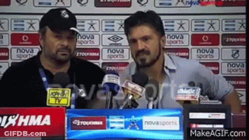 Two Men Are Standing In Front Of Microphones And A Sign That Says Nova Sports GIF