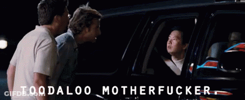 Two Men Are Standing Next To A Car With The Words " Toodaloo Motherfucker " Written On The Bottom GIF