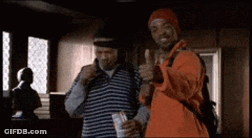 Two Men Are Standing Next To Each Other And Giving A Thumbs Up GIF