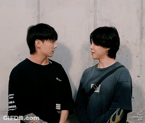 Two Men Are Standing Next To Each Other And One Has A Tattoo On His Arm That Says ' I Love You ' On It GIF