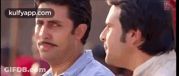 Two Men Are Standing Next To Each Other And One Of Them Has A Mustache On His Face . GIF