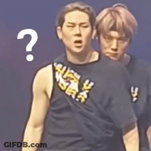 Two Men Are Standing Next To Each Other And One Of Them Has A Question Mark Above His Head GIF