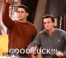 Two Men Are Standing Next To Each Other And One Of Them Is Giving A Thumbs Up . GIF