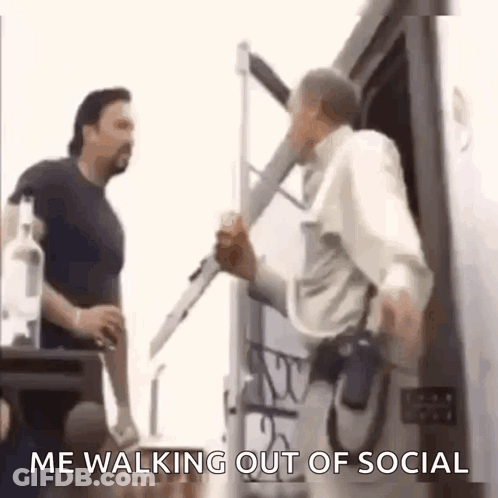 Two Men Are Standing Next To Each Other And One Of Them Is Holding A Bottle Of Vodka . GIF