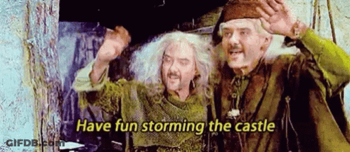 Two Men Are Standing Next To Each Other And One Of Them Is Holding A Sword . GIF