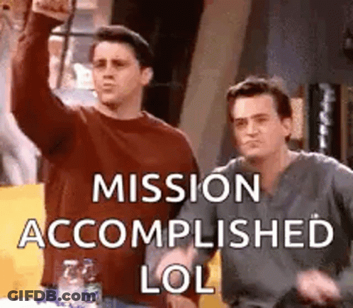 Two Men Are Standing Next To Each Other And One Of Them Is Holding Up His Fist . GIF