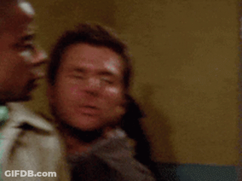 Two Men Are Standing Next To Each Other And One Of Them Is Saying Hold Me Back ! GIF