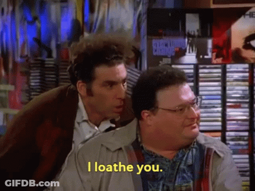 Two Men Are Standing Next To Each Other And One Of Them Is Saying I Loathe You GIF