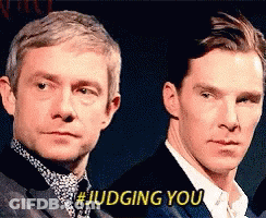 Two Men Are Standing Next To Each Other And One Of Them Is Saying # Judging You . GIF