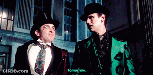 Two Men Are Standing Next To Each Other And One Of Them Is Saying " Tomorrow " GIF