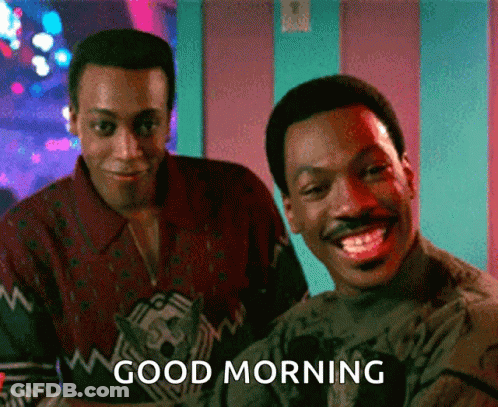Two Men Are Standing Next To Each Other And One Of Them Is Smiling And The Other Is Saying Good Morning GIF