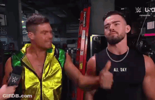 Two Men Are Standing Next To Each Other And One Of Them Is Wearing A Black Tank Top That Says All Day GIF