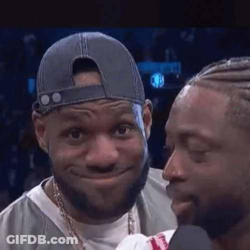 Two Men Are Standing Next To Each Other And One Of Them Is Wearing A Hat And A Necklace . GIF