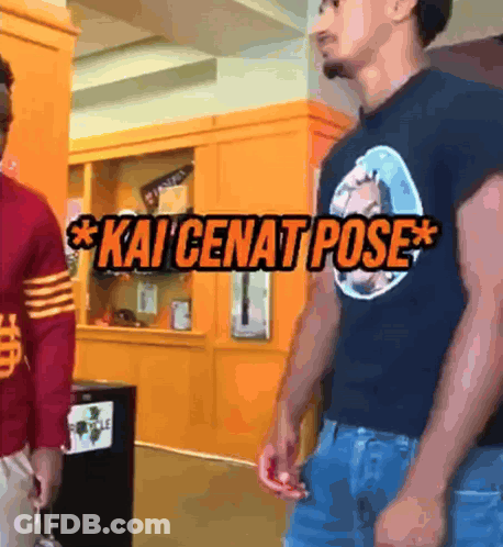 Two Men Are Standing Next To Each Other And One Of Them Is Wearing A Kai Cenat Pose Shirt GIF