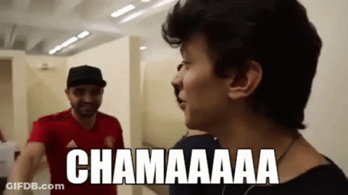 Two Men Are Standing Next To Each Other And One Of Them Is Wearing A Red Shirt That Says Adidas On It . GIF