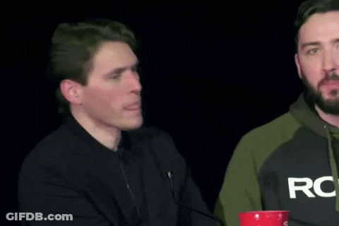 Two Men Are Standing Next To Each Other And One Of Them Is Wearing A Sweatshirt That Says Rog On It . GIF