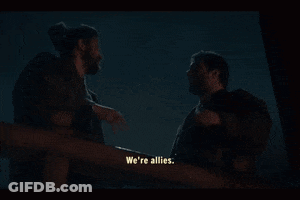 Two Men Are Standing Next To Each Other And One Of Them Says We 'Re Allies GIF