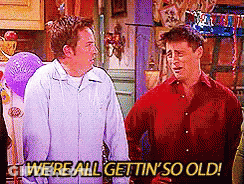 Two Men Are Standing Next To Each Other And Saying We 'Re All Gettin ' So Old . GIF