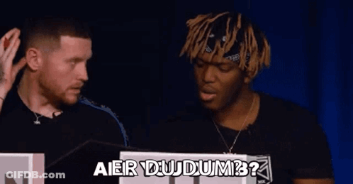 Two Men Are Standing Next To Each Other And Talking . GIF