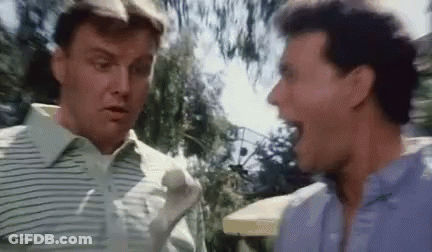 Two Men Are Standing Next To Each Other And Talking . GIF