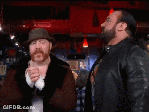 Two Men Are Standing Next To Each Other And The Word Banger Is On The Bottom GIF
