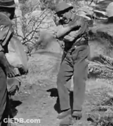 Two Men Are Standing Next To Each Other In A Black And White Photo . GIF