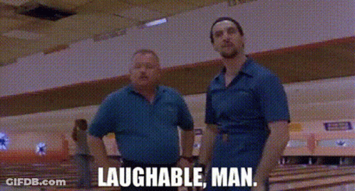 Two Men Are Standing Next To Each Other In A Bowling Alley And The Words Laughable Man Are Written On The Screen . GIF