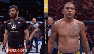 Two Men Are Standing Next To Each Other In A Boxing Ring And One Has A Shirt That Says Crypto.com On It GIF