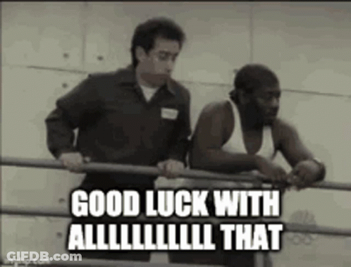 Two Men Are Standing Next To Each Other In A Boxing Ring And One Of Them Is Holding A Bar . GIF