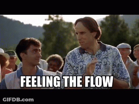 Two Men Are Standing Next To Each Other In A Crowd And One Of Them Is Saying `` Feeling The Flow '' . GIF