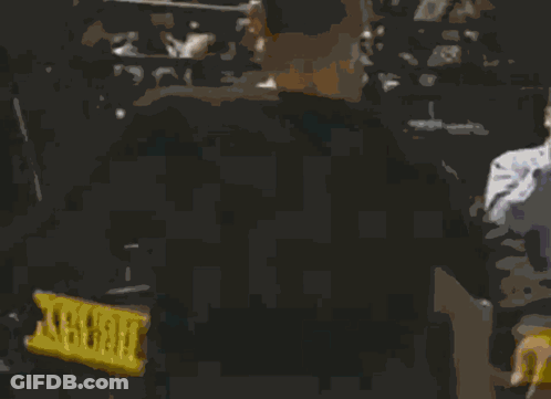 Two Men Are Standing Next To Each Other In A Dark Room And One Has The Number 10 On His Shirt GIF