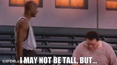 Two Men Are Standing Next To Each Other In A Gym And One Of Them Is Saying I May Not Be Tall But GIF