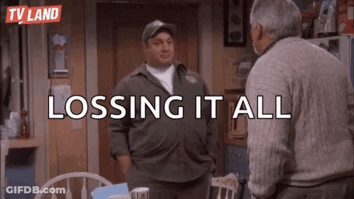 Two Men Are Standing Next To Each Other In A Kitchen And Talking . GIF