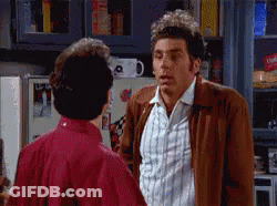 Two Men Are Standing Next To Each Other In A Kitchen GIF