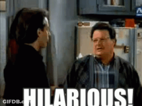 Two Men Are Standing Next To Each Other In A Kitchen With The Words Hilarious Written On The Bottom . GIF
