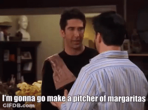 Two Men Are Standing Next To Each Other In A Living Room Talking . GIF