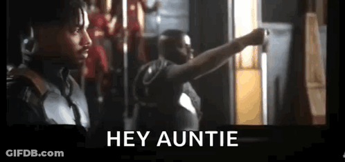 Two Men Are Standing Next To Each Other In A Room And One Of Them Is Pointing At The Camera . GIF