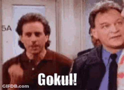 Two Men Are Standing Next To Each Other In A Room And One Of Them Is Saying `` Goku ! '' GIF