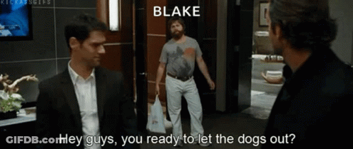 Two Men Are Standing Next To Each Other In A Room And One Of Them Is Talking To The Other About Letting The Dogs Out . GIF