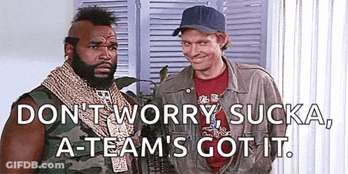 Two Men Are Standing Next To Each Other In A Room And One Of Them Is Wearing A Baseball Cap . GIF