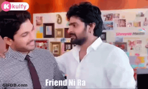 Two Men Are Standing Next To Each Other In A Room Talking To Each Other . GIF