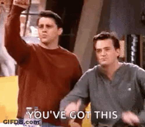 Two Men Are Standing Next To Each Other In A Room . GIF