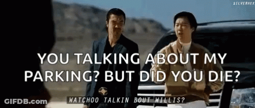 Two Men Are Standing Next To Each Other In Front Of A Car Talking About Parking . GIF