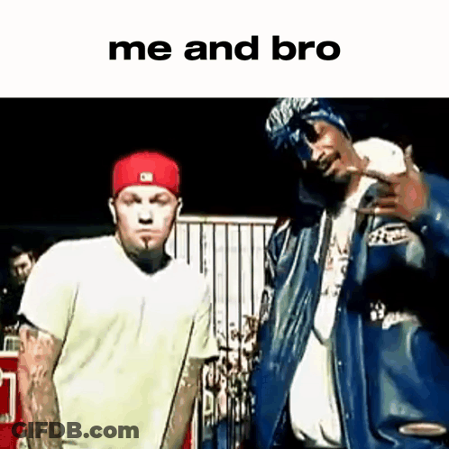 Two Men Are Standing Next To Each Other In Front Of A Crowd . GIF