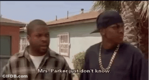 Two Men Are Standing Next To Each Other In Front Of A House . GIF
